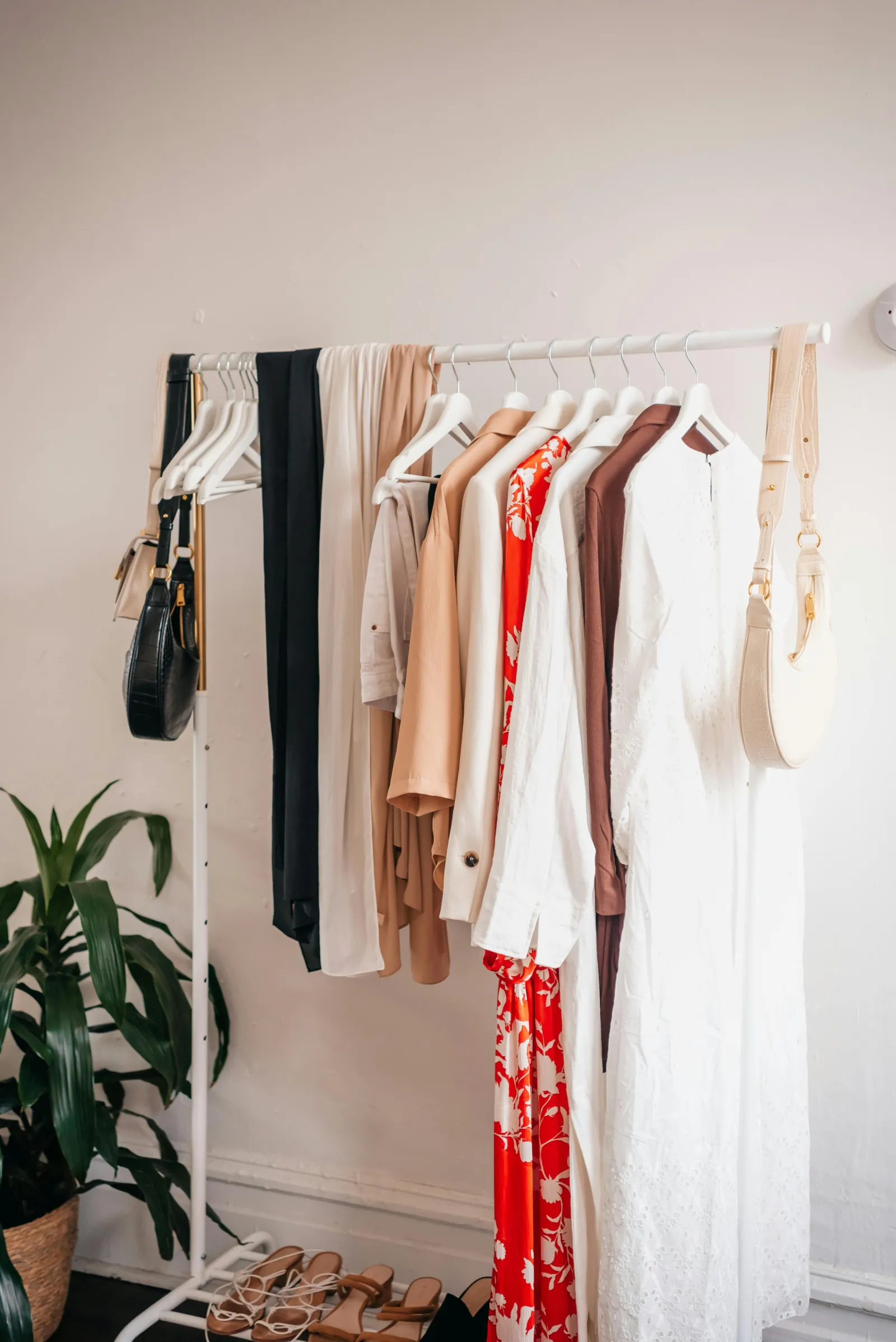 A rail filled with items of clothing on hangers