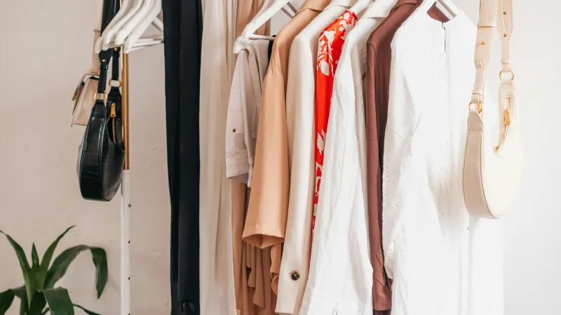 A rail filled with items of clothing on hangers